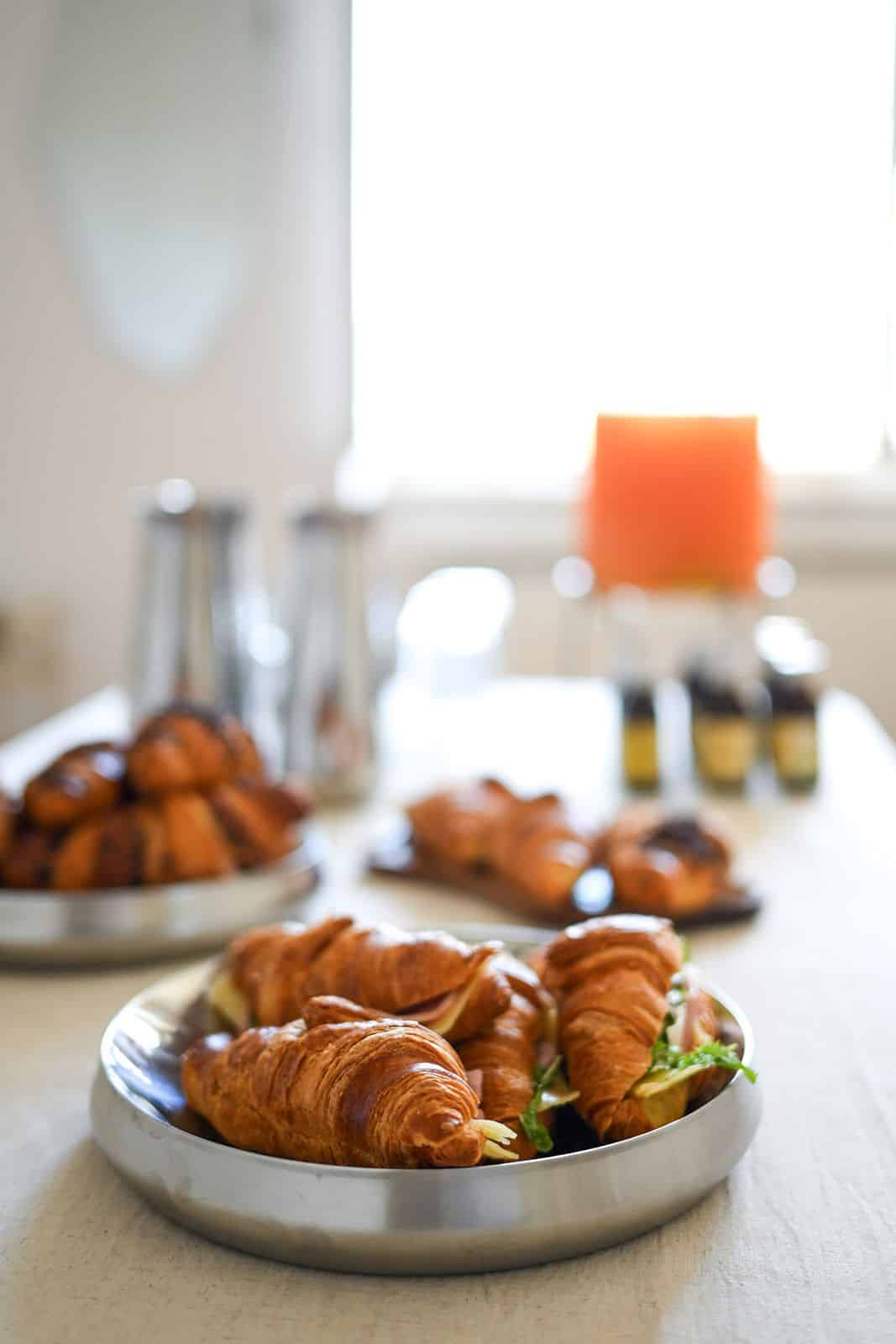 Croissants on a tray prepared for the participants' breakfast