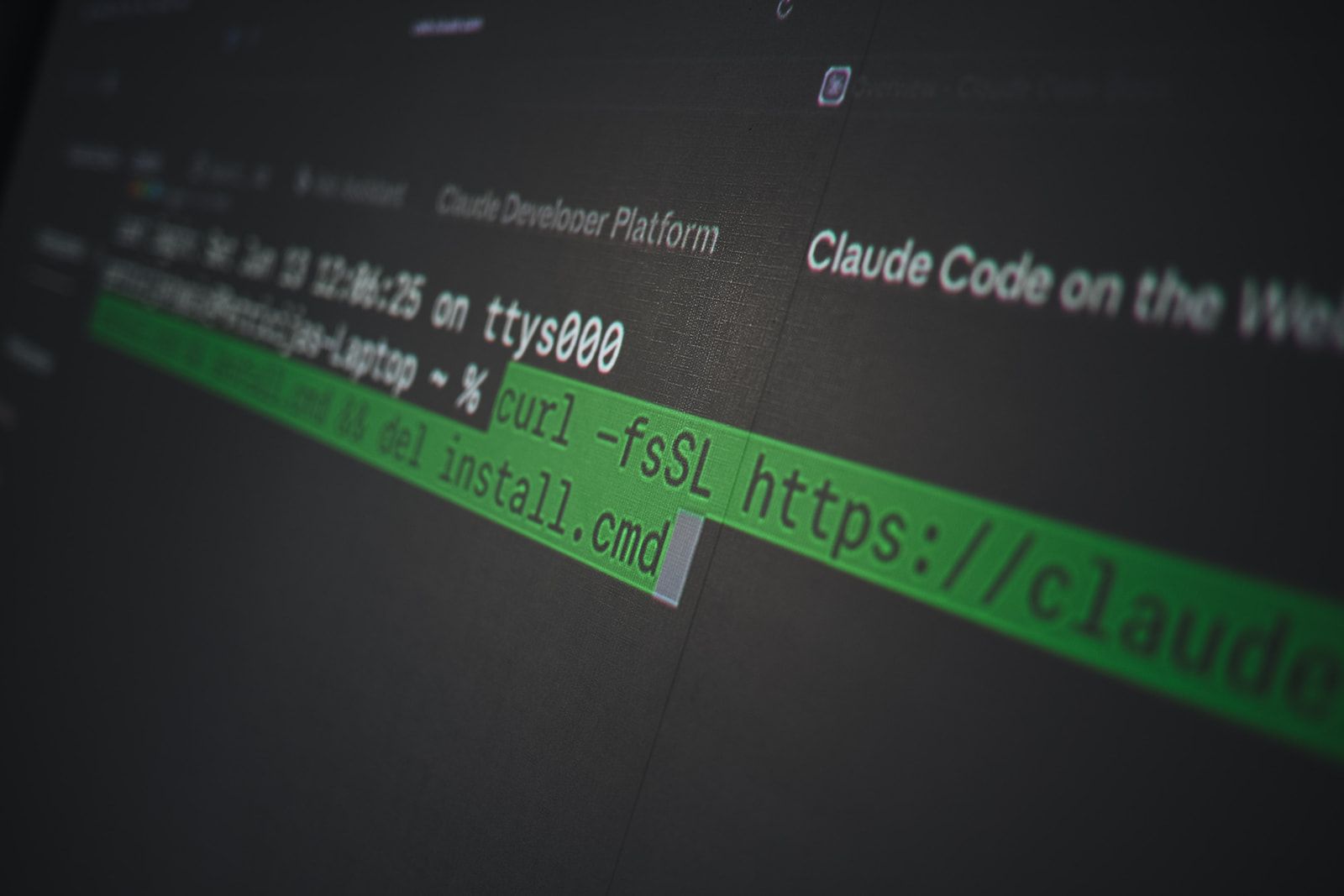 A terminal on screen with the command to install Claude Code