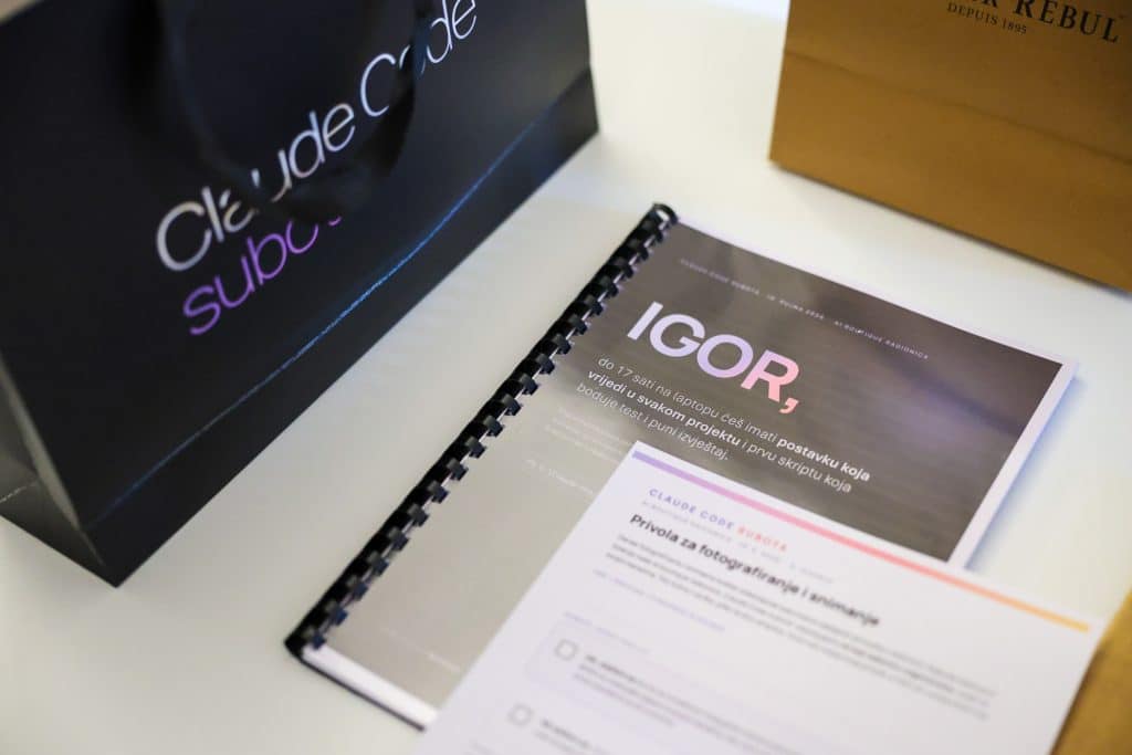 A personalised AI handbook with a participant's name on the table at Claude Code Saturday