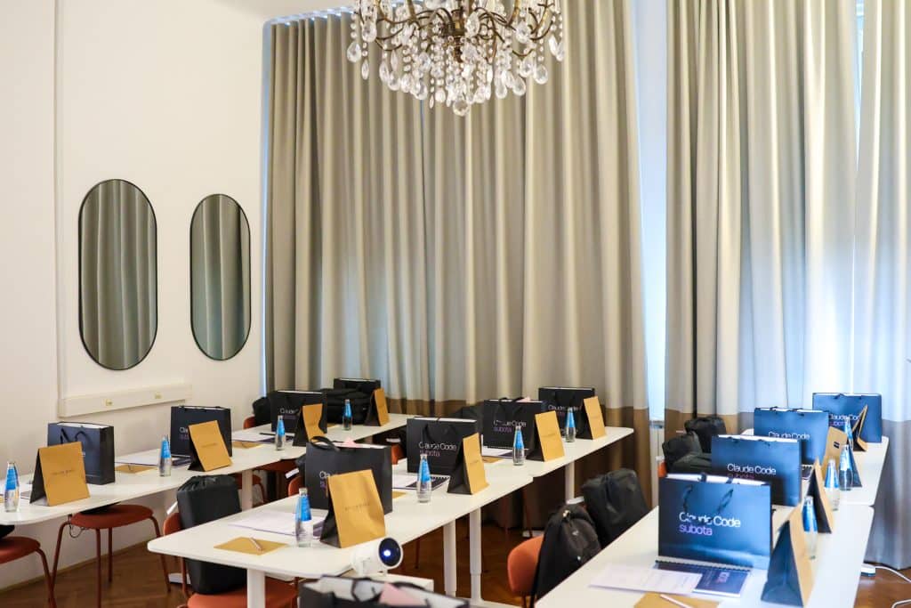 Tables in Hub7 Studio prepared for participants, with gift bags and handbooks