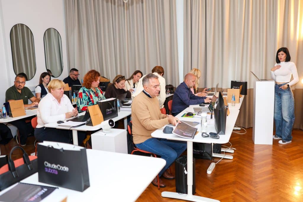 Participants of Claude Code Saturday working on laptops in Hub7 Studio while Patricija Topić leads the first block
